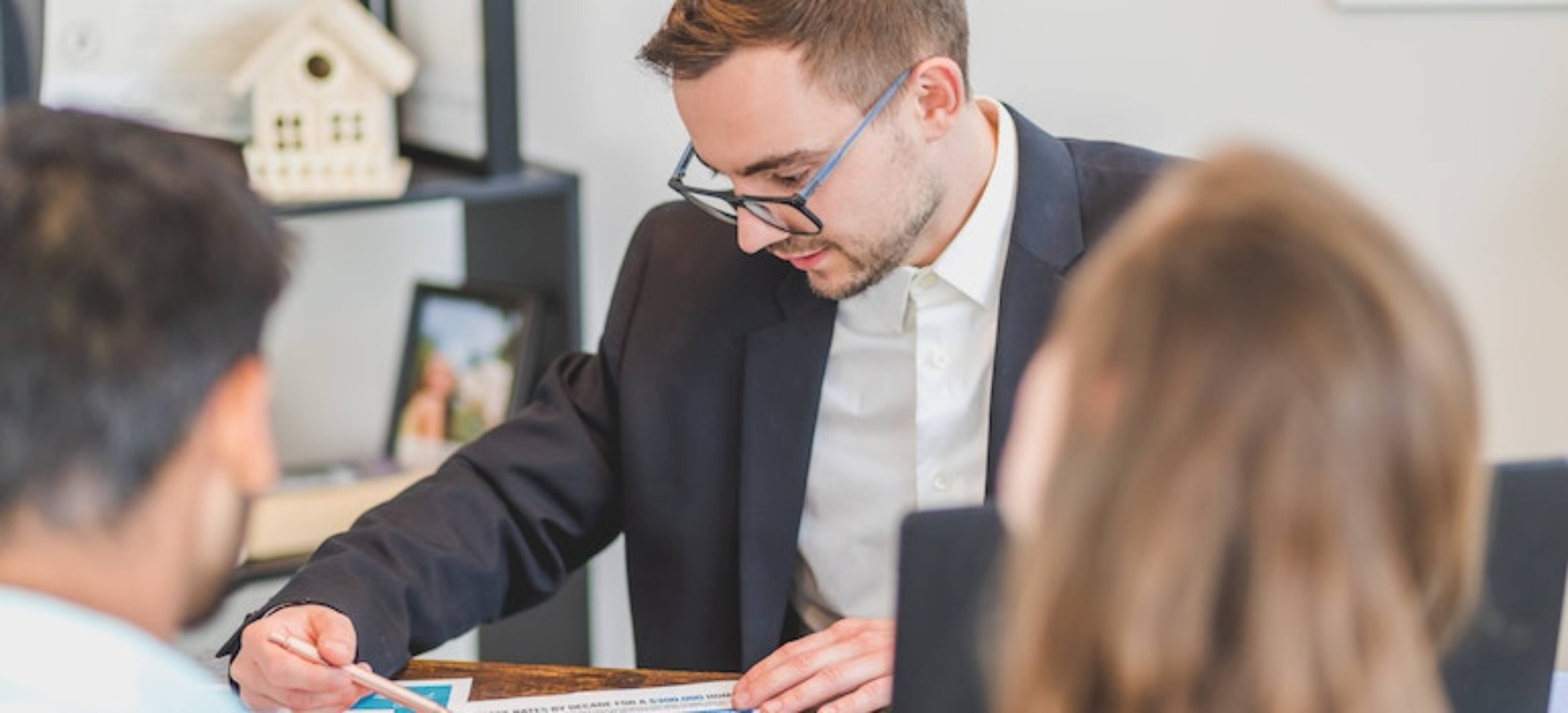 Buyers discussing a contract with their agent